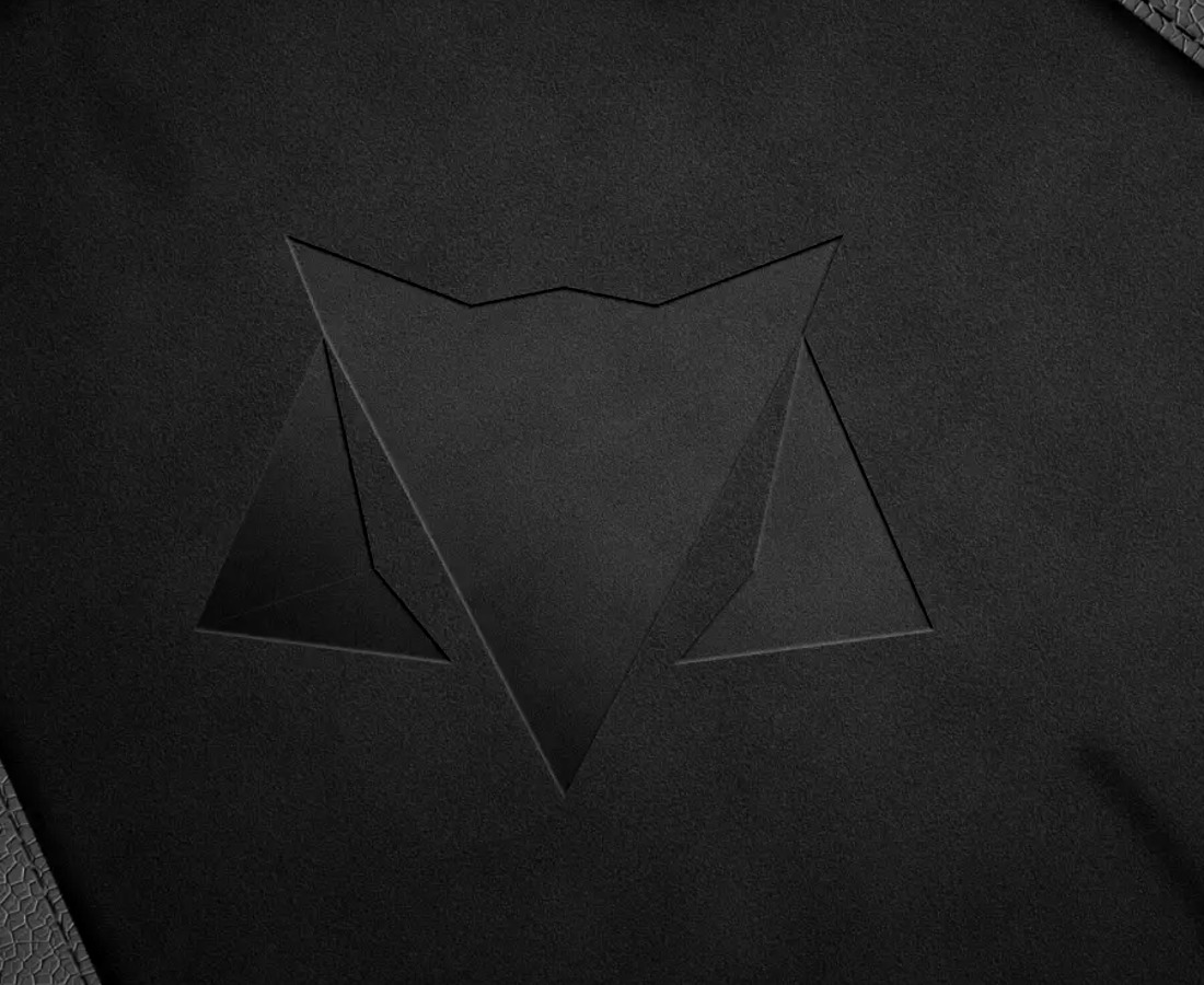 Brand mark embossed on dark material